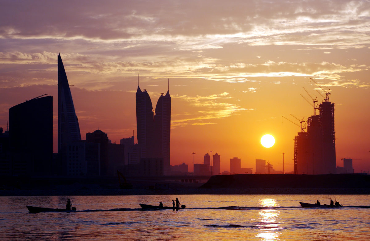 boats-in-queue-and-bahrain-skyline-at-sunset