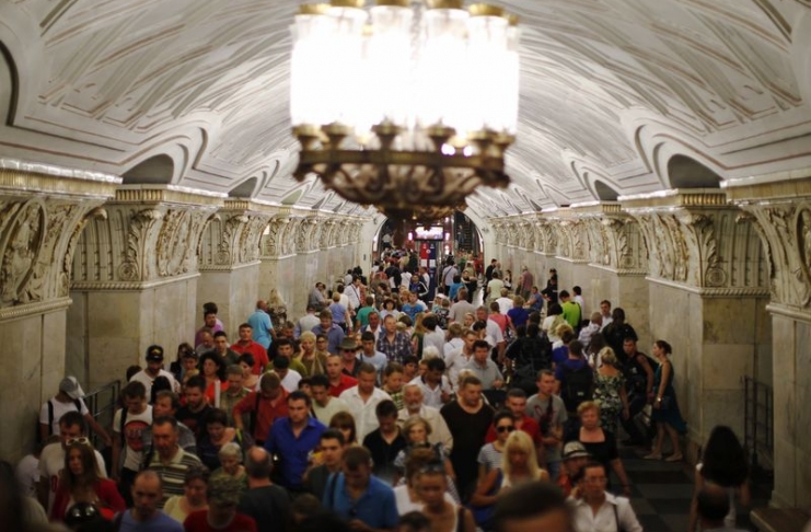 People walk through Prospekt Mira metro station in Moscow