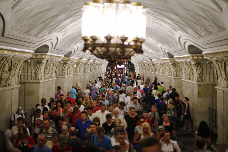People walk through Prospekt Mira metro station in Moscow