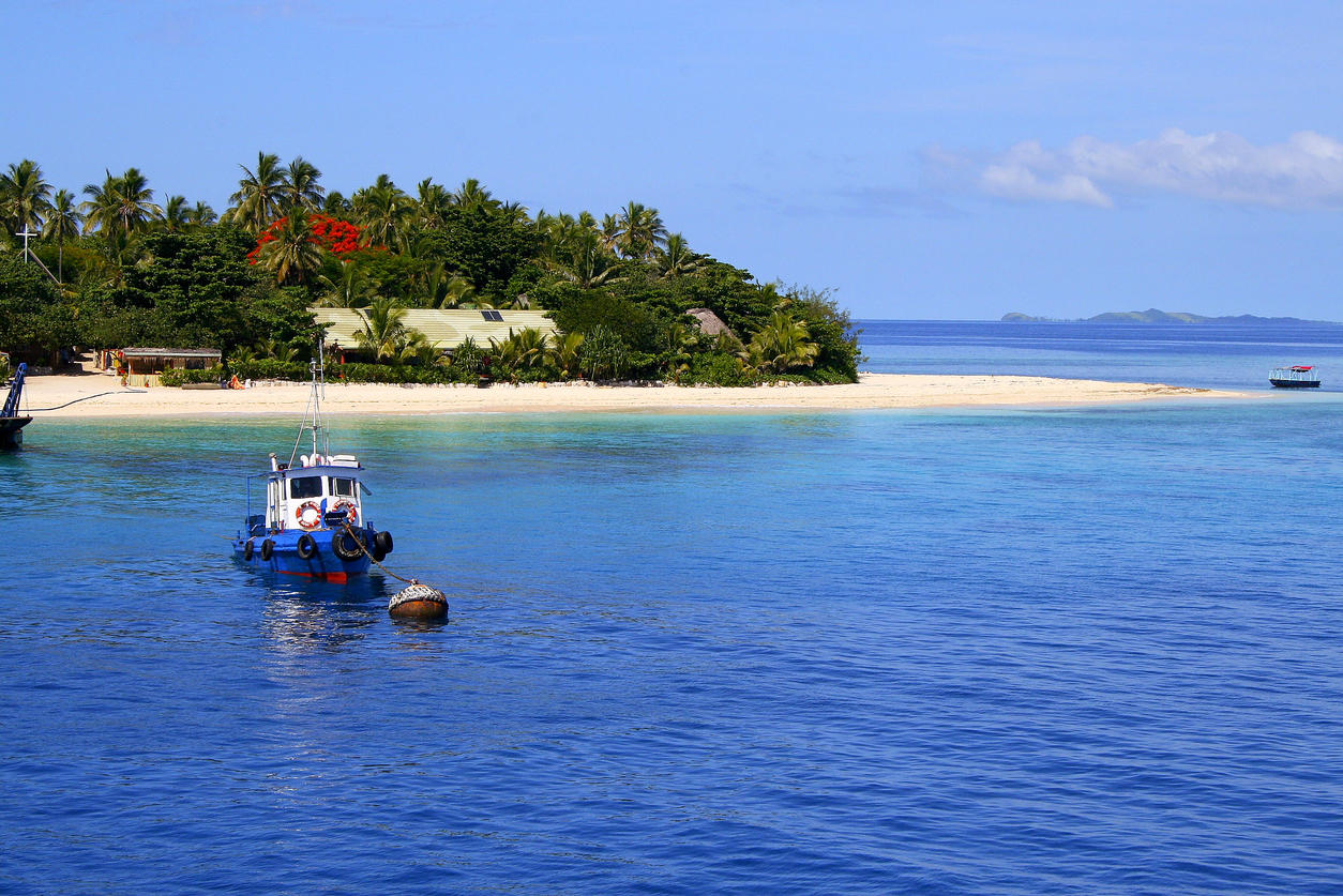 Ship anchored and Tropical paradise island: Dreamlike Sand deserted turquoise beach, Idyllic Yasawas, Fiji Islands