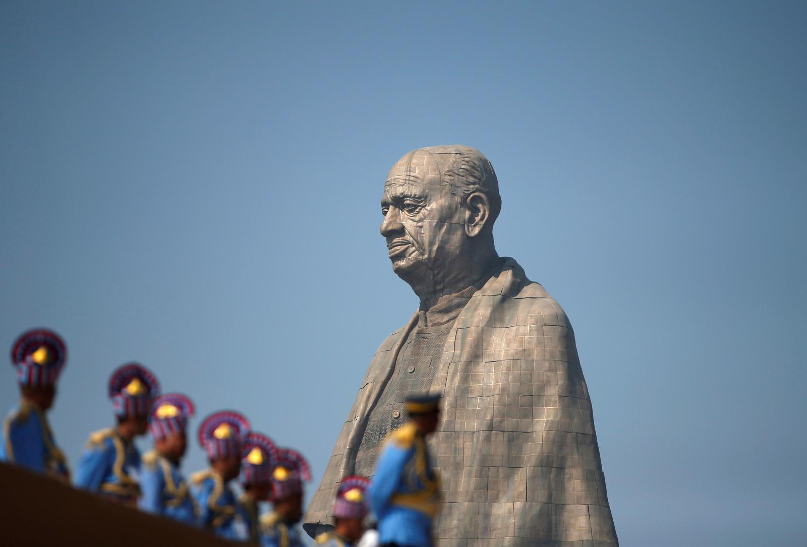 Police officers stand near the “Statue of Unity” portraying Sardar Vallabhbhai Patel, one of the founding fathers of India, during its inauguration in Kevadia