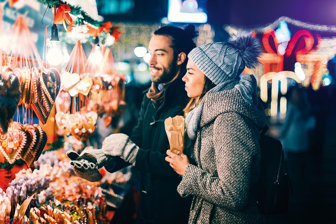 Young Couple Having Fun Outdoors At Christmas Time