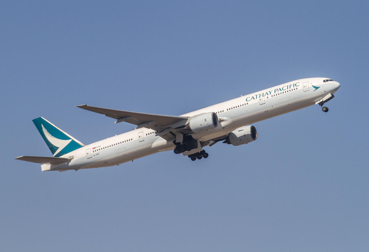 A Cathay Pacific Boeing 777 painted in the new livery departing Hong Kong.