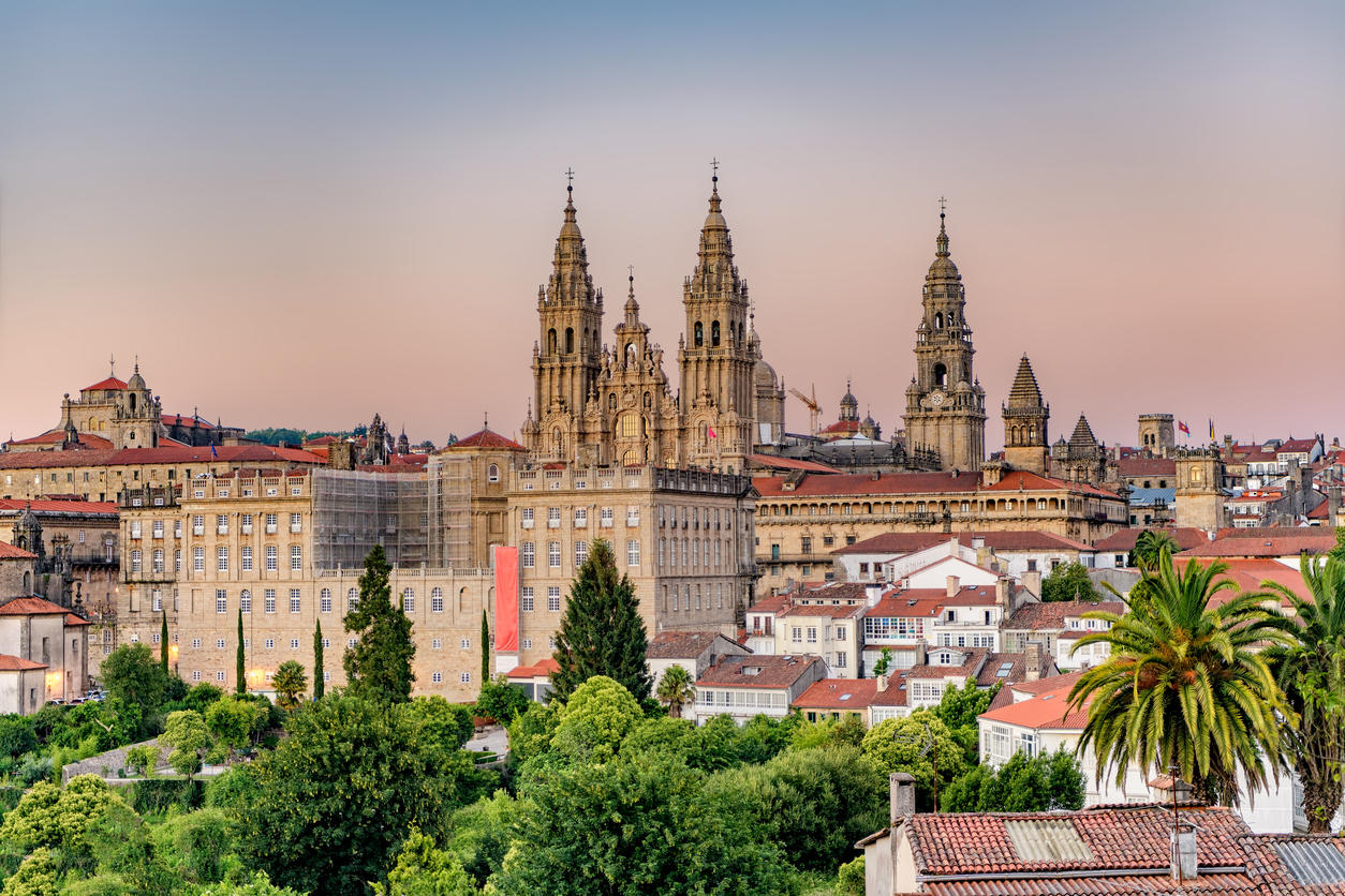 Hazy sunset on Santiago de Compostela cathedral and city view.