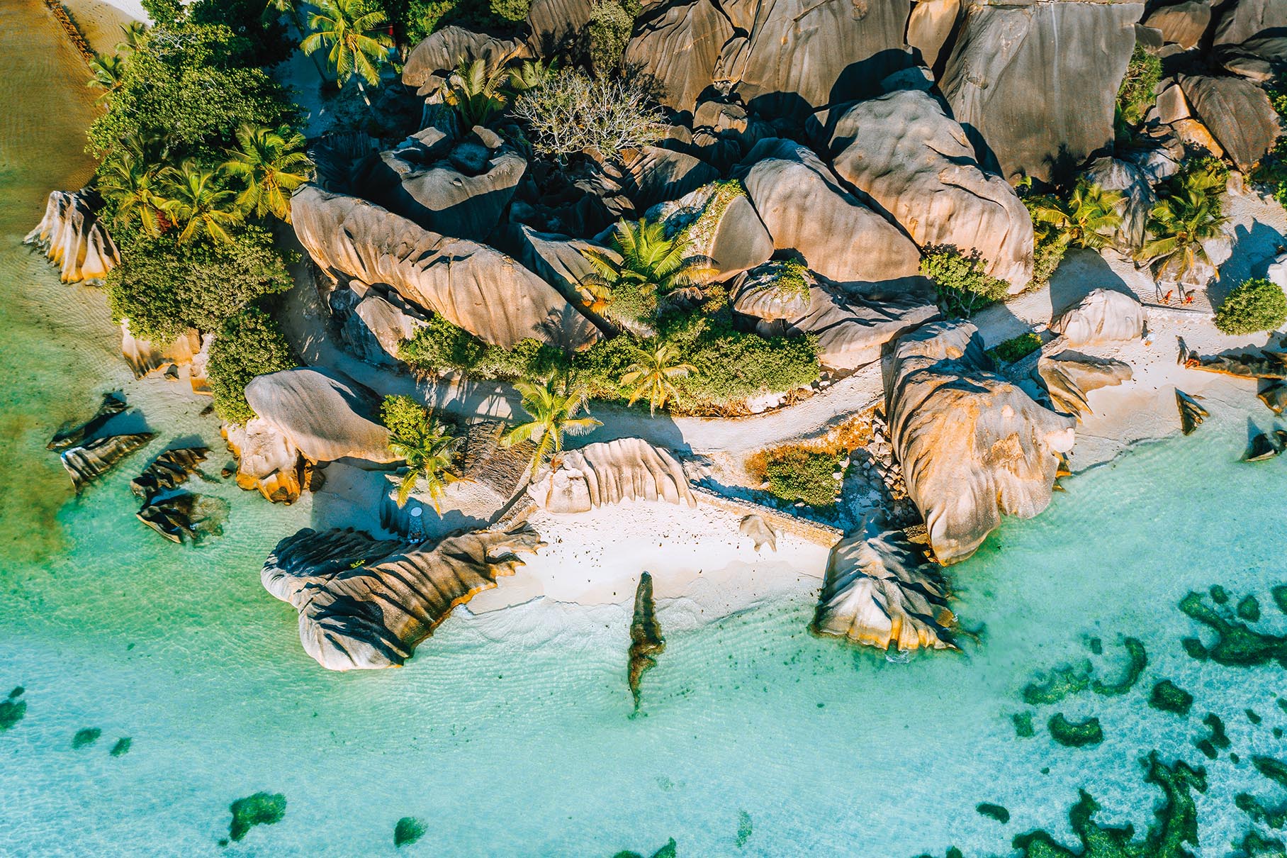 Aerial photo of beautiful famous paradise tropical beach Anse Source D Argent at La Digue island, Seychelles. Summer vacation, travel and lifestyle concept