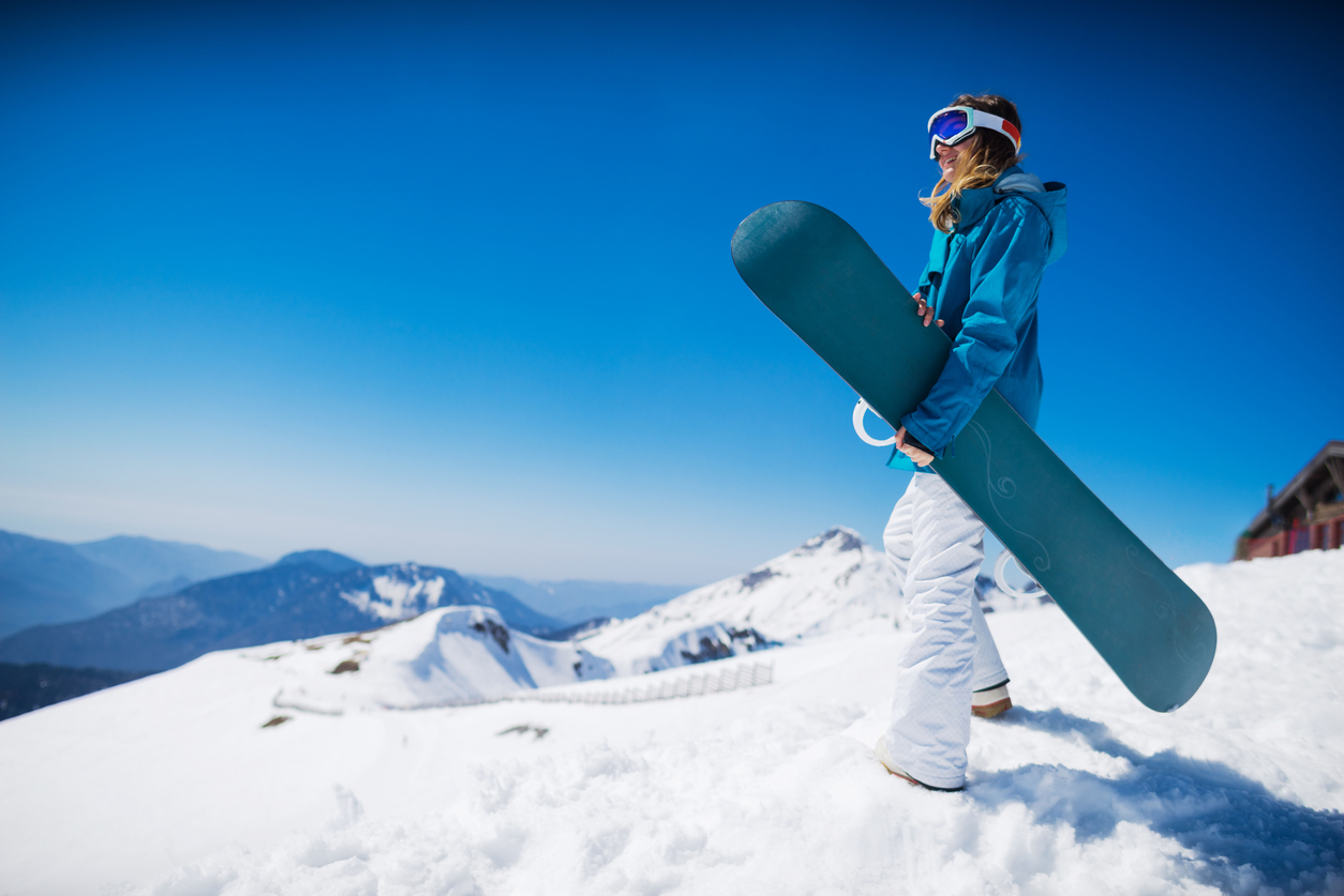 young  snowboarder woman